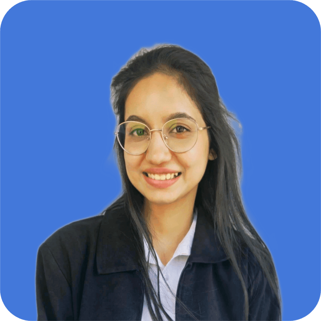 Smiling person with glasses and long hair against a blue background. | Digii Ninja